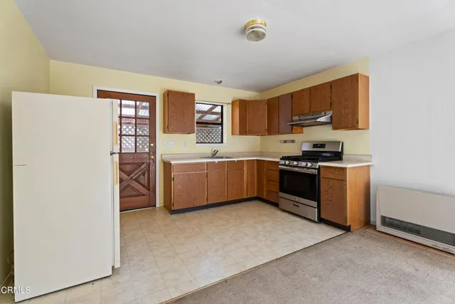 a view of an empty room with windows