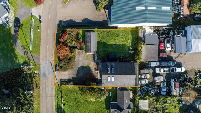 a view of a house with a yard and plants