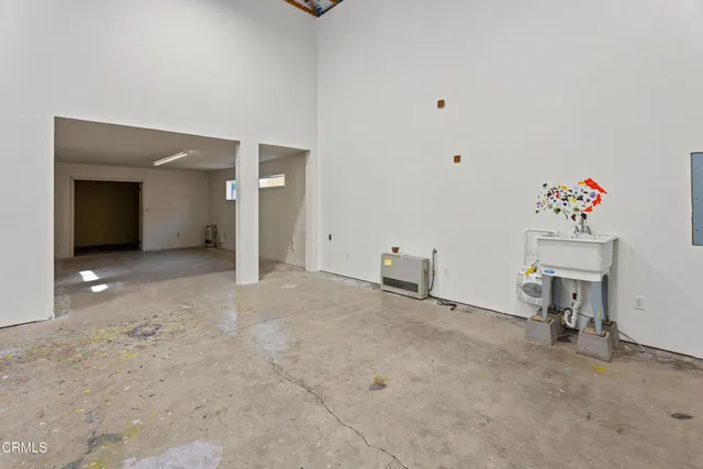a view of livingroom with furniture and a chandelier fan