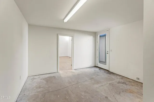 an empty room with closet area