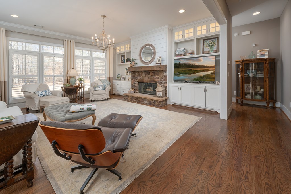1652 Pierce Road Waverly Hall, GA 31831 - Photo 14 of 51 a living room with furniture a fireplace and a flat screen tv