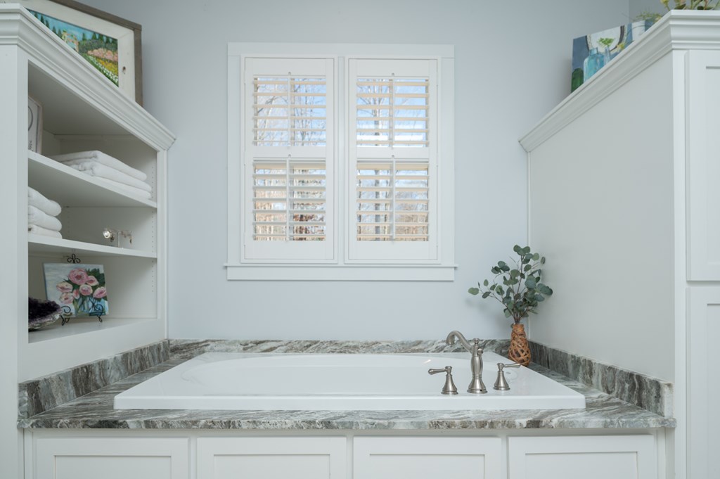 1652 Pierce Road Waverly Hall, GA 31831 - Photo 34 of 51 a bathroom with a granite countertop sink and a window