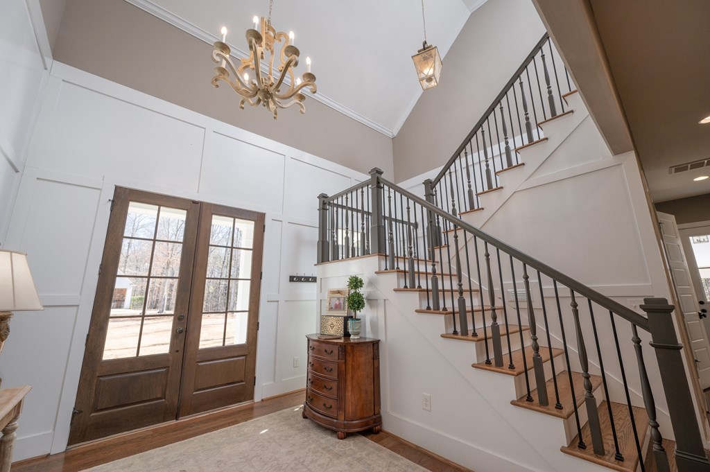 1652 Pierce Road Waverly Hall, GA 31831 - Photo 38 of 51 a view of staircase with wooden floor and a chandelier