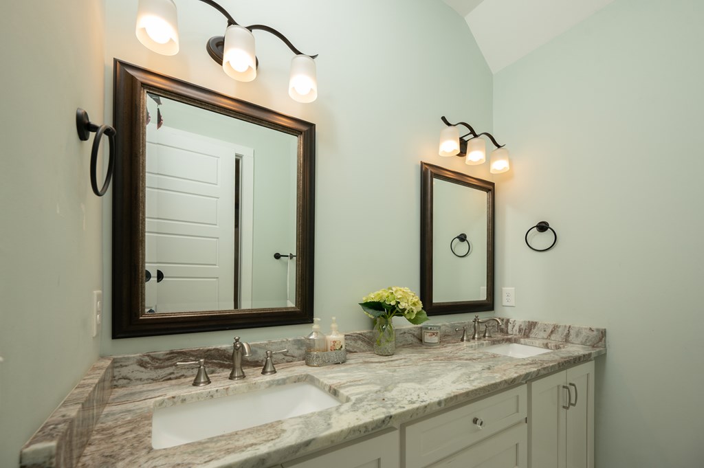 1652 Pierce Road Waverly Hall, GA 31831 - Photo 41 of 51 a bathroom with a granite countertop sink and a mirror