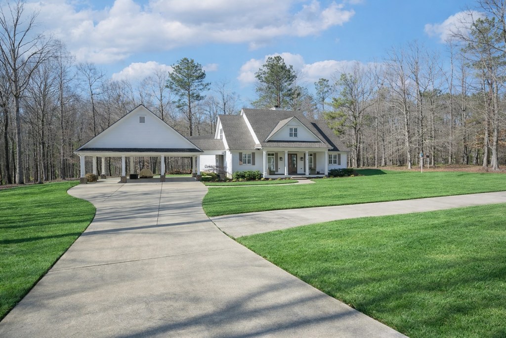 1652 Pierce Road Waverly Hall, GA 31831 - Photo 5 of 51 a front view of a house with garden