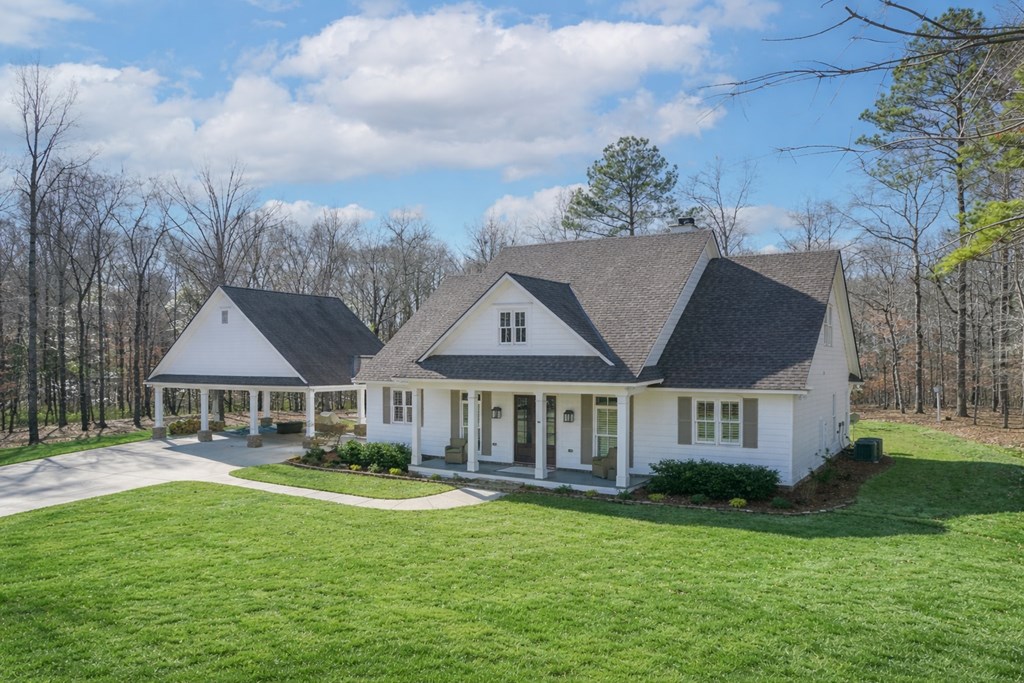 1652 Pierce Road Waverly Hall, GA 31831 - Photo 9 of 51 a front view of a house with garden