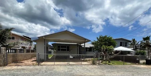 a view of a house with backyard porch and garden