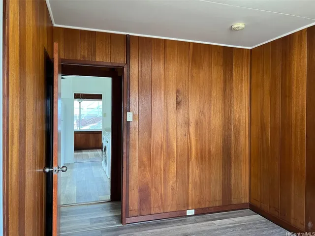 a view of a elevator with wooden floor