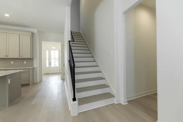 a view of a hallway with entryway wooden floor and entryway