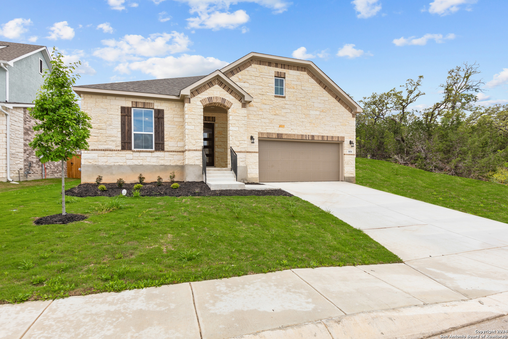1036 Aidenbaum San Antonio, TX 78260 - Photo 1 of 1 a front view of a house with a garden and yard