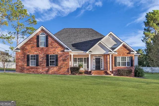 front view of a house with a yard