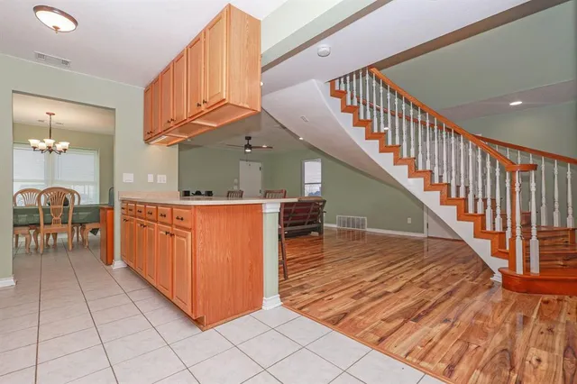 a kitchen with stainless steel appliances a sink and cabinets