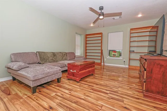 a bedroom with two beds and next to ceiling window