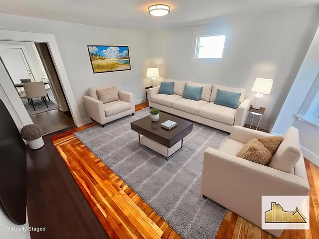 a living room with furniture and a rug