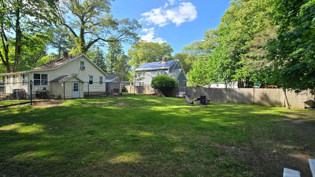 32 Birch Road Natick, MA 01760 - Photo 8 of 38 a front view of a house with garden