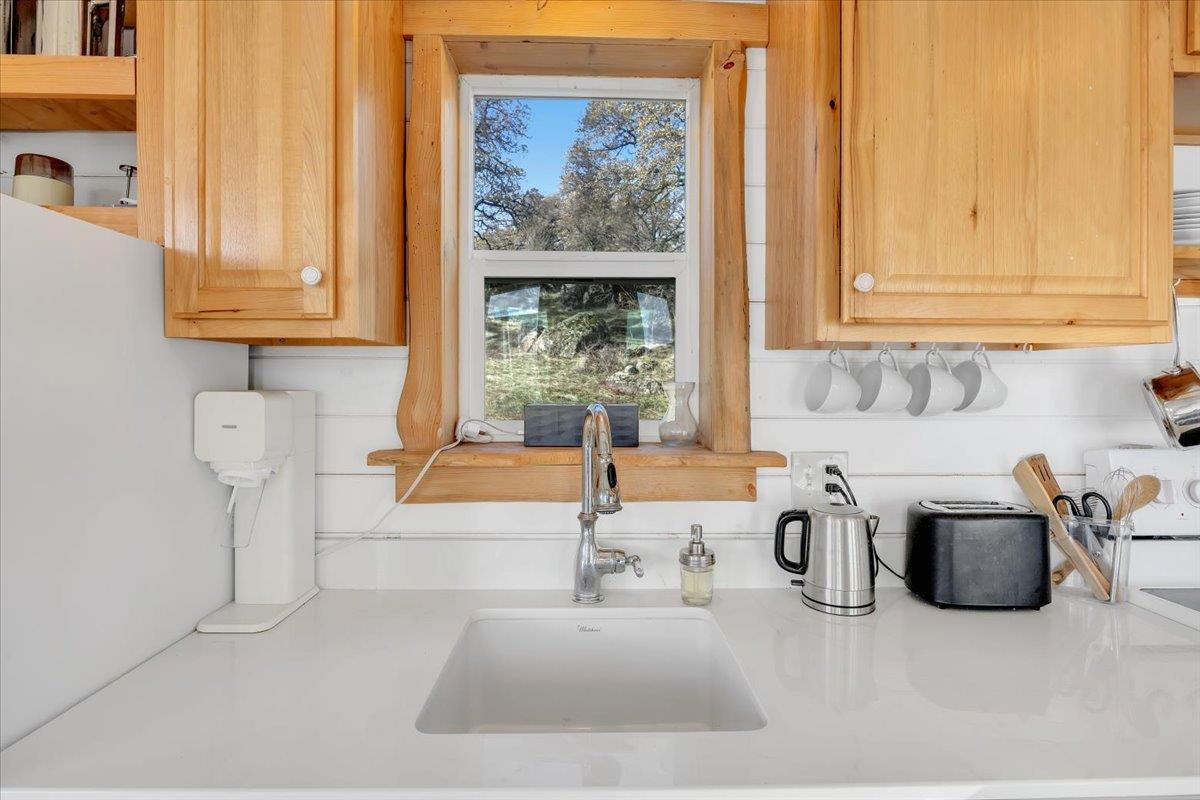 2460 Sulkey Court Copperopolis, CA 95228 - Photo 15 of 91 Solid-surface counter and a sink with a view!