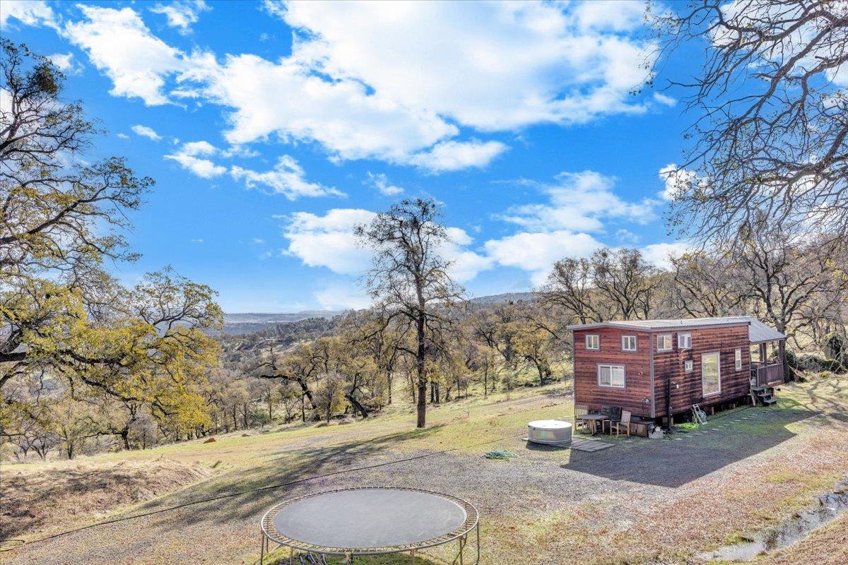 2460 Sulkey Court Copperopolis, CA 95228 - Photo 37 of 91 a backyard of a house with table and chairs