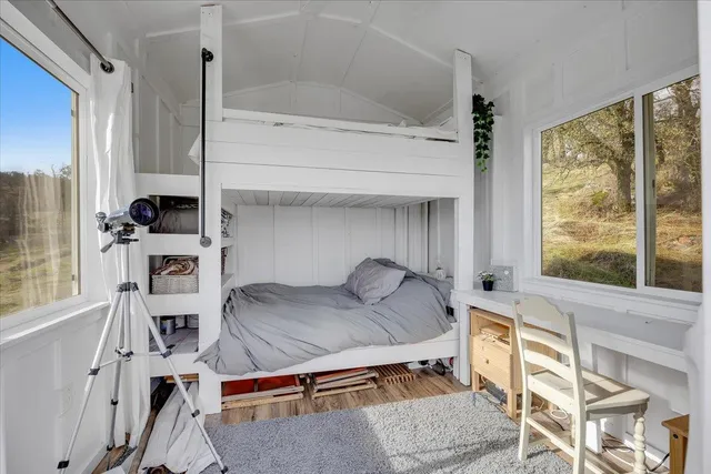 a front view of a building with a garden