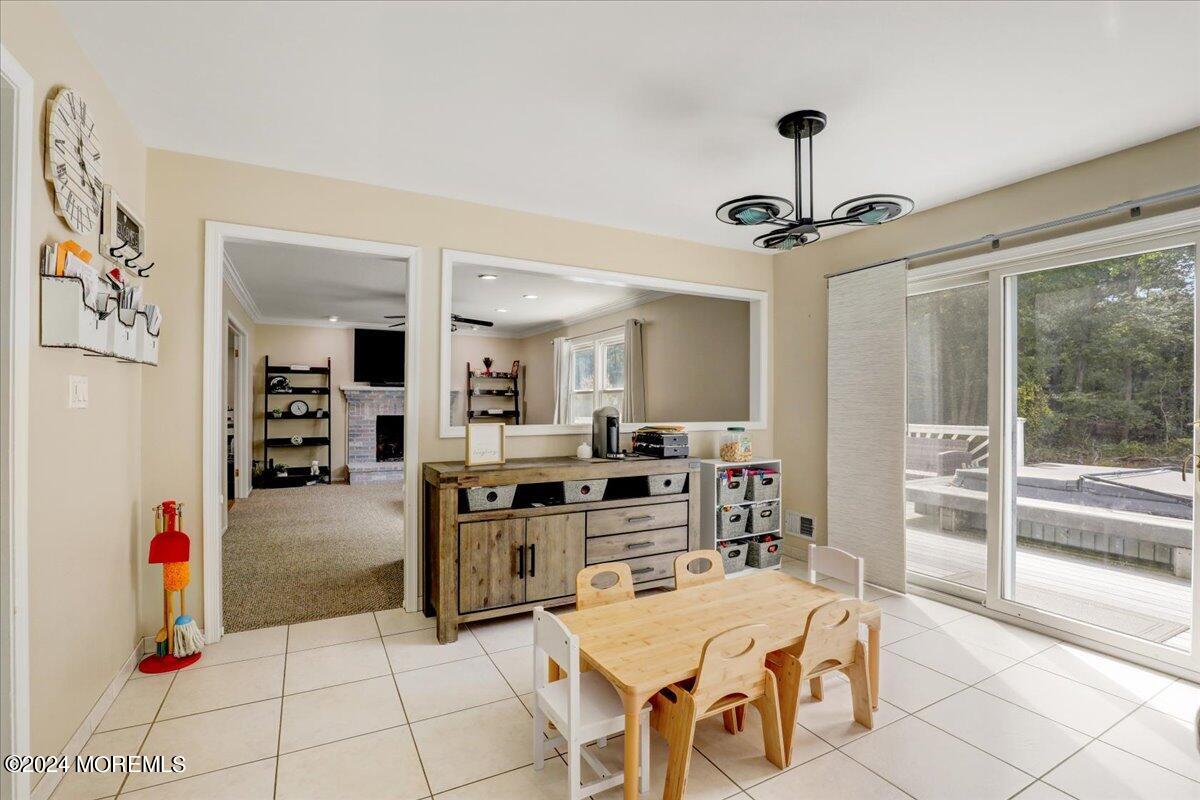 61 Apache Drive Manalapan, NJ 07726 - Photo 12 of 37 a kitchen with stainless steel appliances kitchen island granite countertop a refrigerator and stove