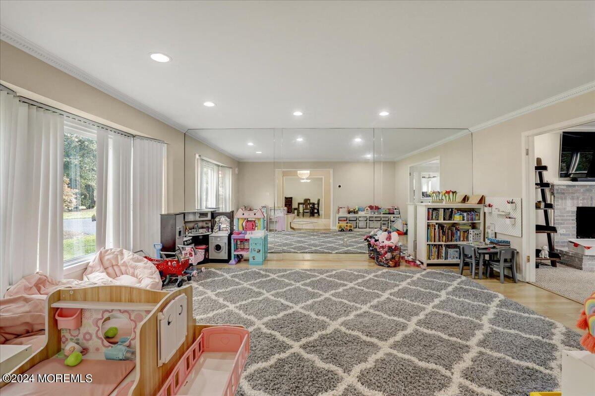 61 Apache Drive Manalapan, NJ 07726 - Photo 13 of 37 a living room with lots of furniture and a large window