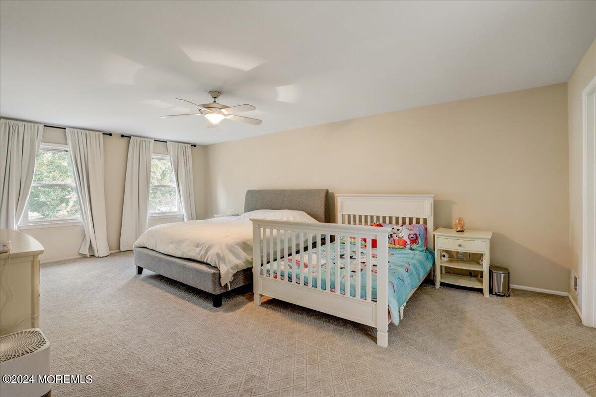 61 Apache Drive Manalapan, NJ 07726 - Photo 21 of 37 a bedroom with a bed and a window