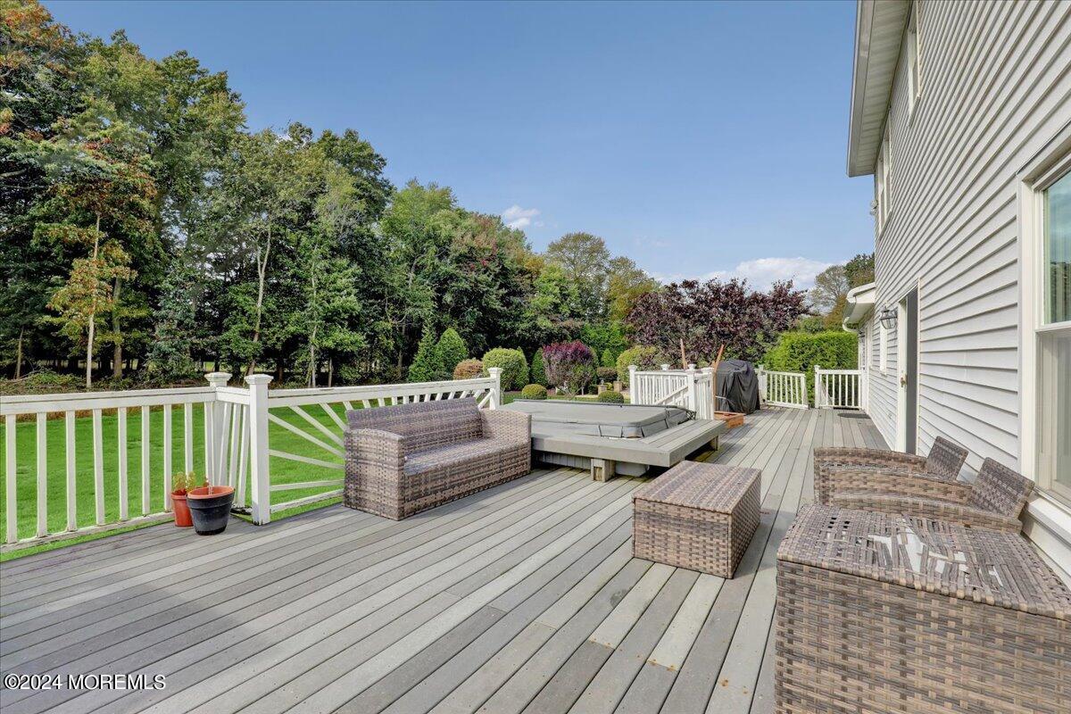 61 Apache Drive Manalapan, NJ 07726 - Photo 32 of 37 a view of balcony with furniture and trees