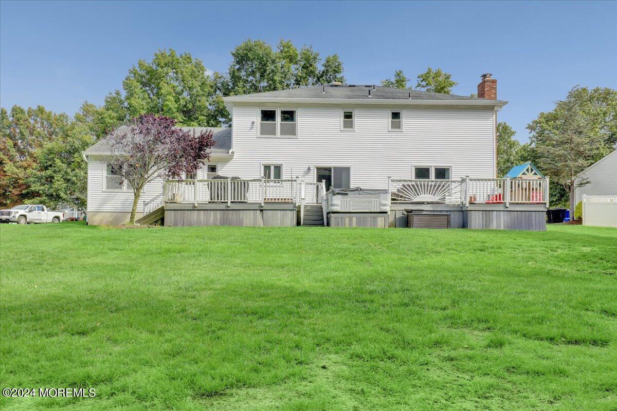 61 Apache Drive Manalapan, NJ 07726 - Photo 33 of 37 a view of house with backyard and garden