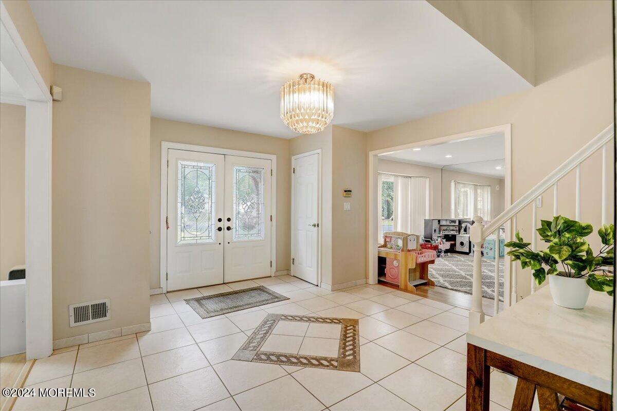 61 Apache Drive Manalapan, NJ 07726 - Photo 6 of 37 a living room with furniture