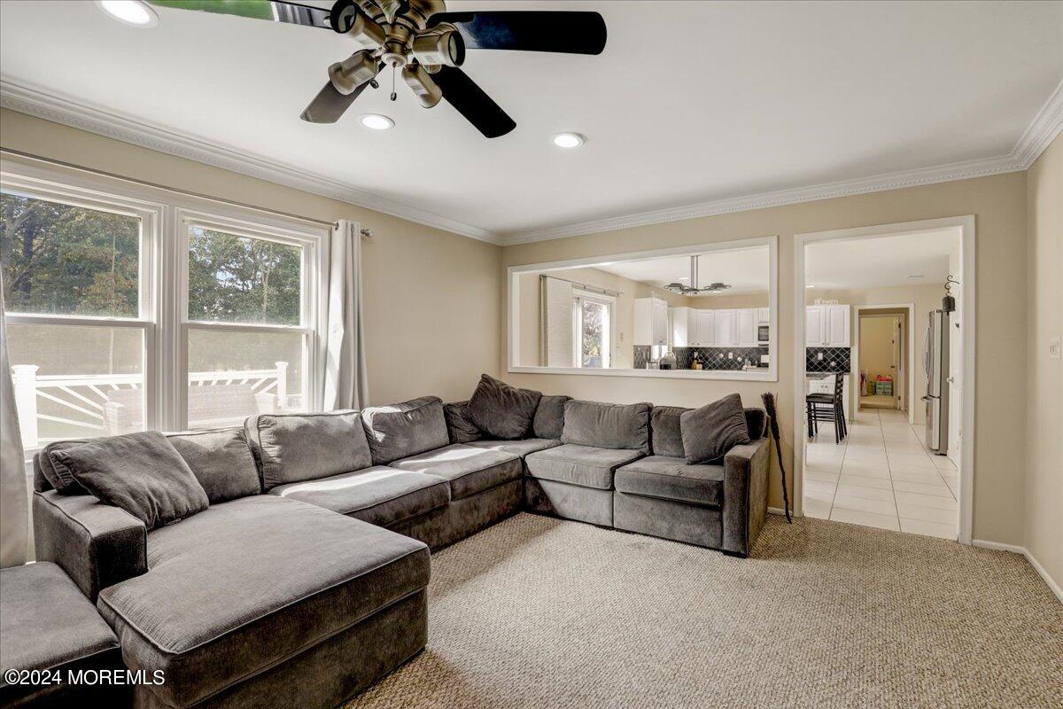 61 Apache Drive Manalapan, NJ 07726 - Photo 8 of 37 a living room with furniture and a large window