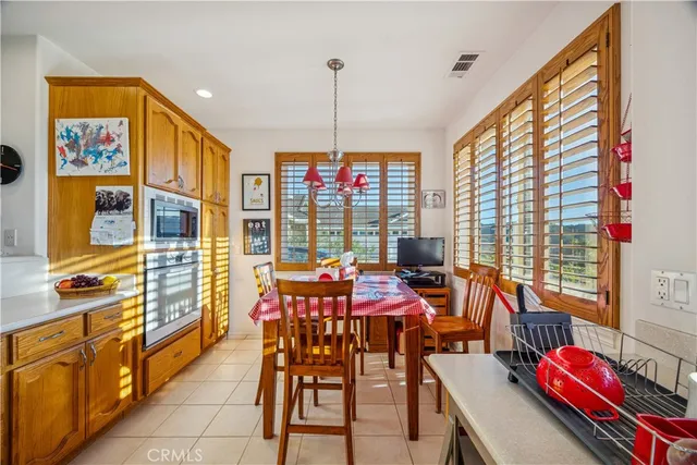 a view of a dining room with furniture window and outdoor kitchen