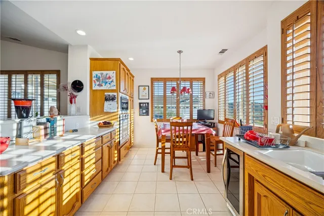 a very nice looking open dining room with kitchen area