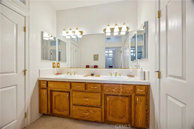a bathroom with a sink vanity and mirror