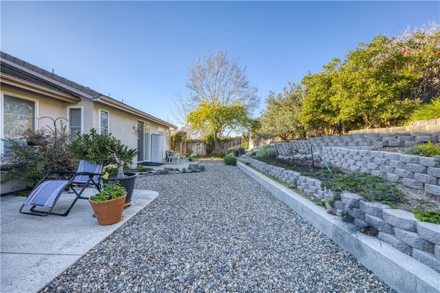 a view of a garden with a patio