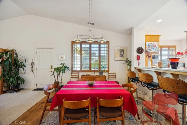 a view of a dining room with furniture and window