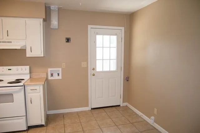 a view of storage and utility room with closet dryer