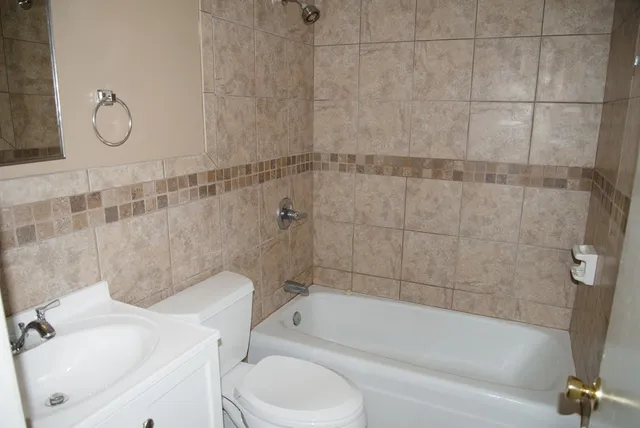 a bathroom with a sink a toilet and a bathtub