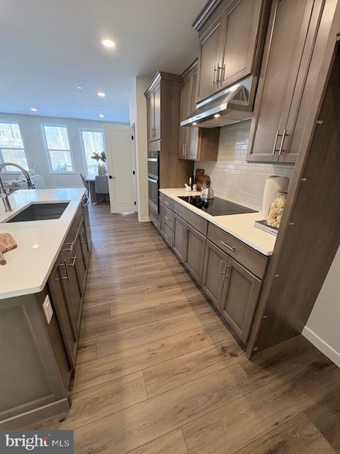 30 Grayson Lane Downingtown, PA 19335 - Photo 4 of 29 a large kitchen with stainless steel appliances granite countertop a lot of counter space and wooden floors