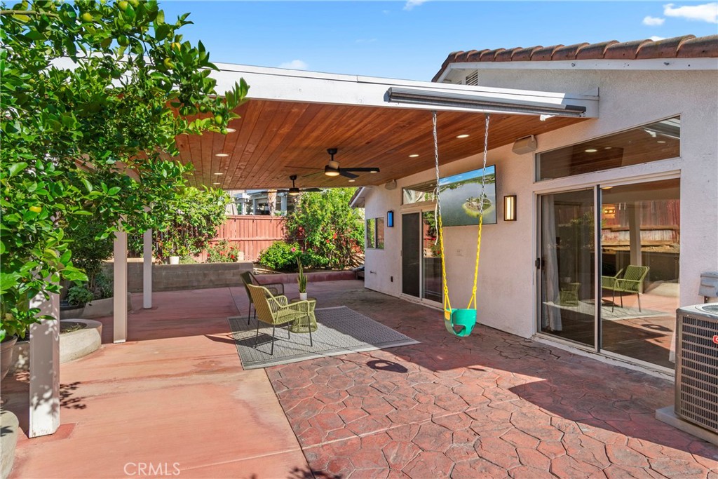 16366 West Sun Canyon Street Riverside, CA 92503 - Photo 19 of 21 a view of a patio with table and chairs potted plants
