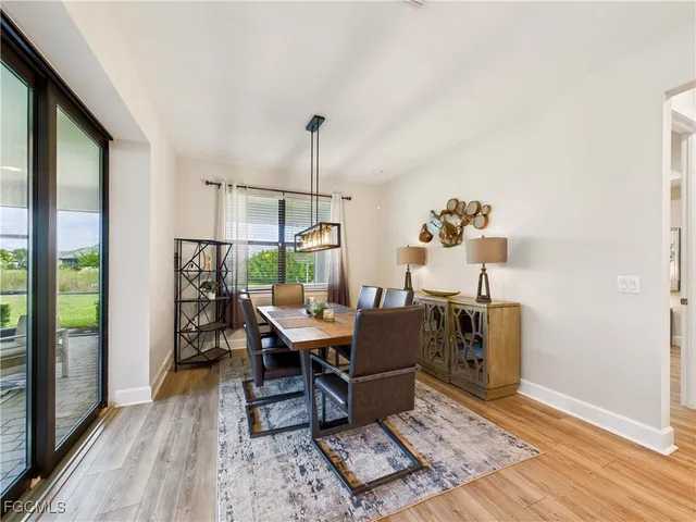a workspace with furniture window and wooden floor