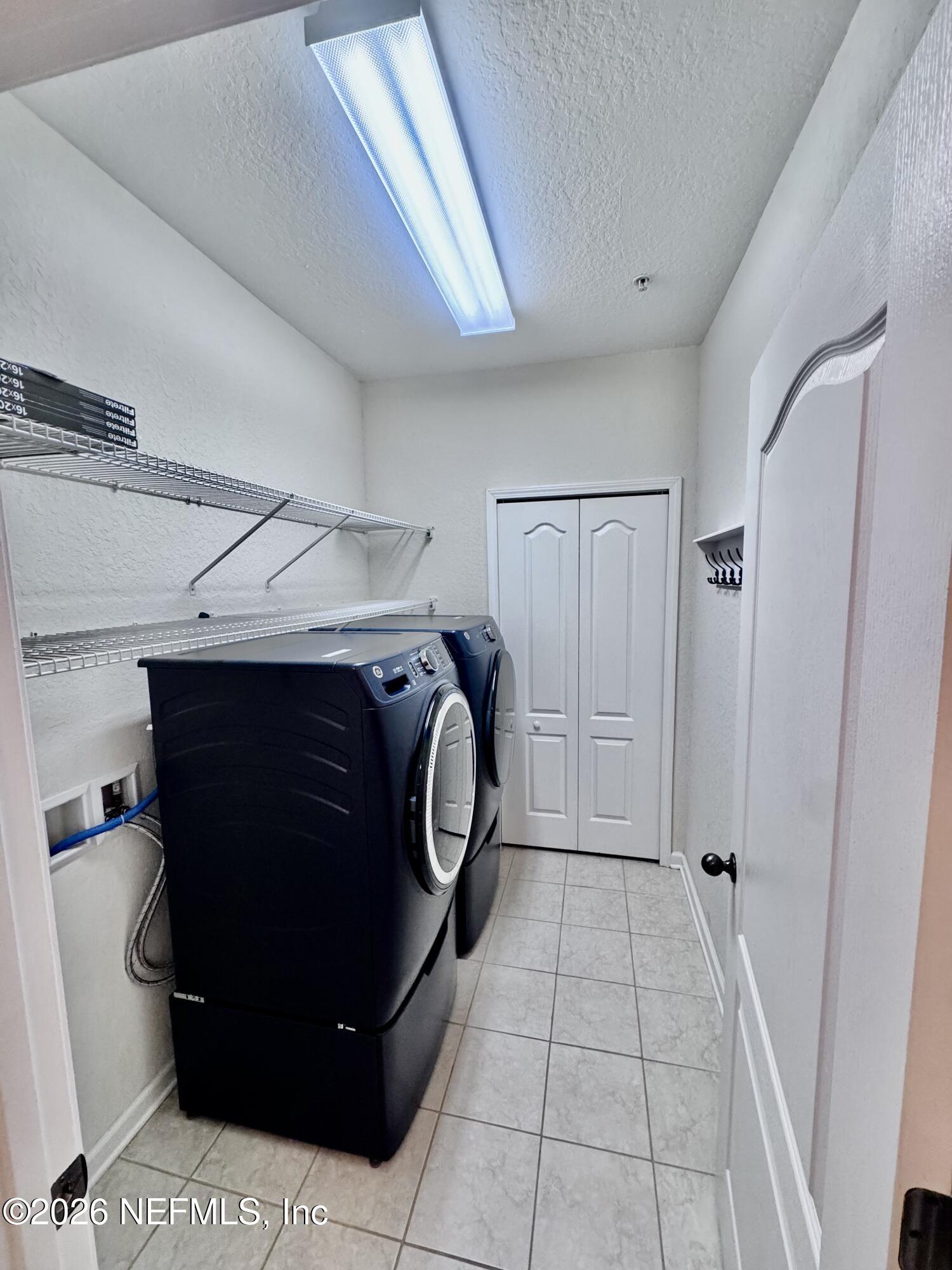 110 Magnolia Crossing Point, Unit 1903 St. Augustine, FL 32086 - Photo 21 of 26 a utility room with dryer and washer