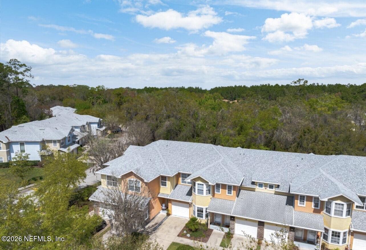 110 Magnolia Crossing Point, Unit 1903 St. Augustine, FL 32086 - Photo 29 of 31 an aerial view of multiple houses with a lake view