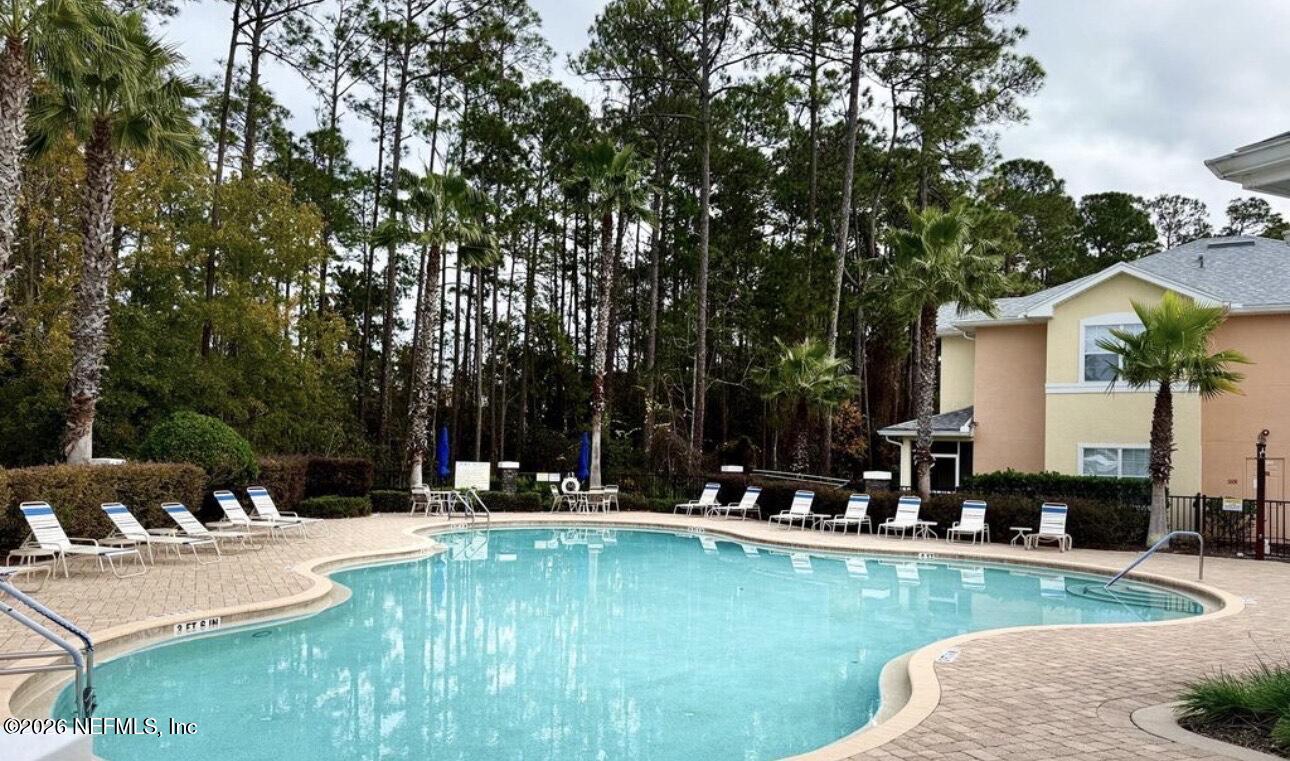 110 Magnolia Crossing Point, Unit 1903 St. Augustine, FL 32086 - Photo 30 of 31 a view of a swimming pool with chairs