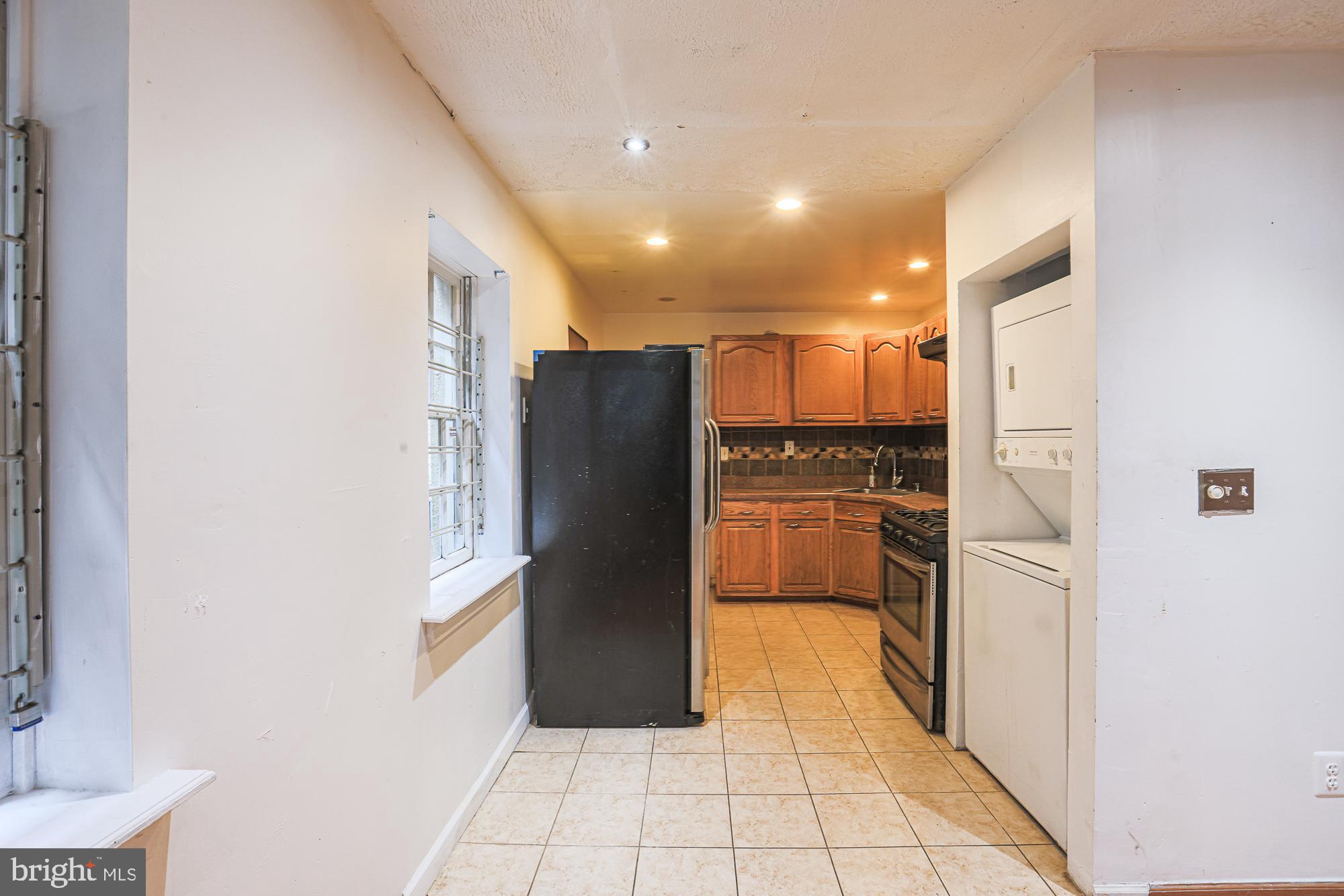 337 Scott Street Baltimore, MD 21230 - Photo 12 of 31 a kitchen with stainless steel appliances a refrigerator and a stove top oven