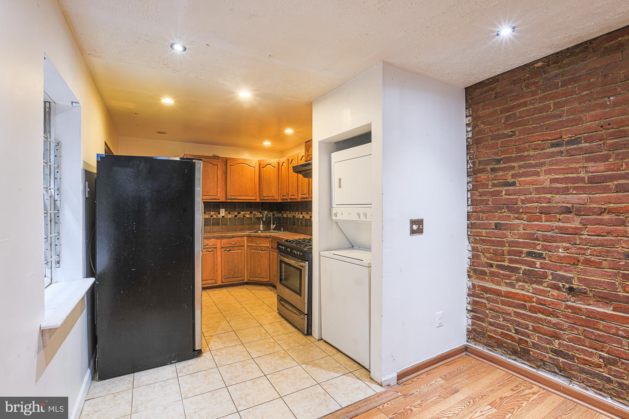 337 Scott Street Baltimore, MD 21230 - Photo 13 of 31 a view of a refrigerator in kitchen and an empty room