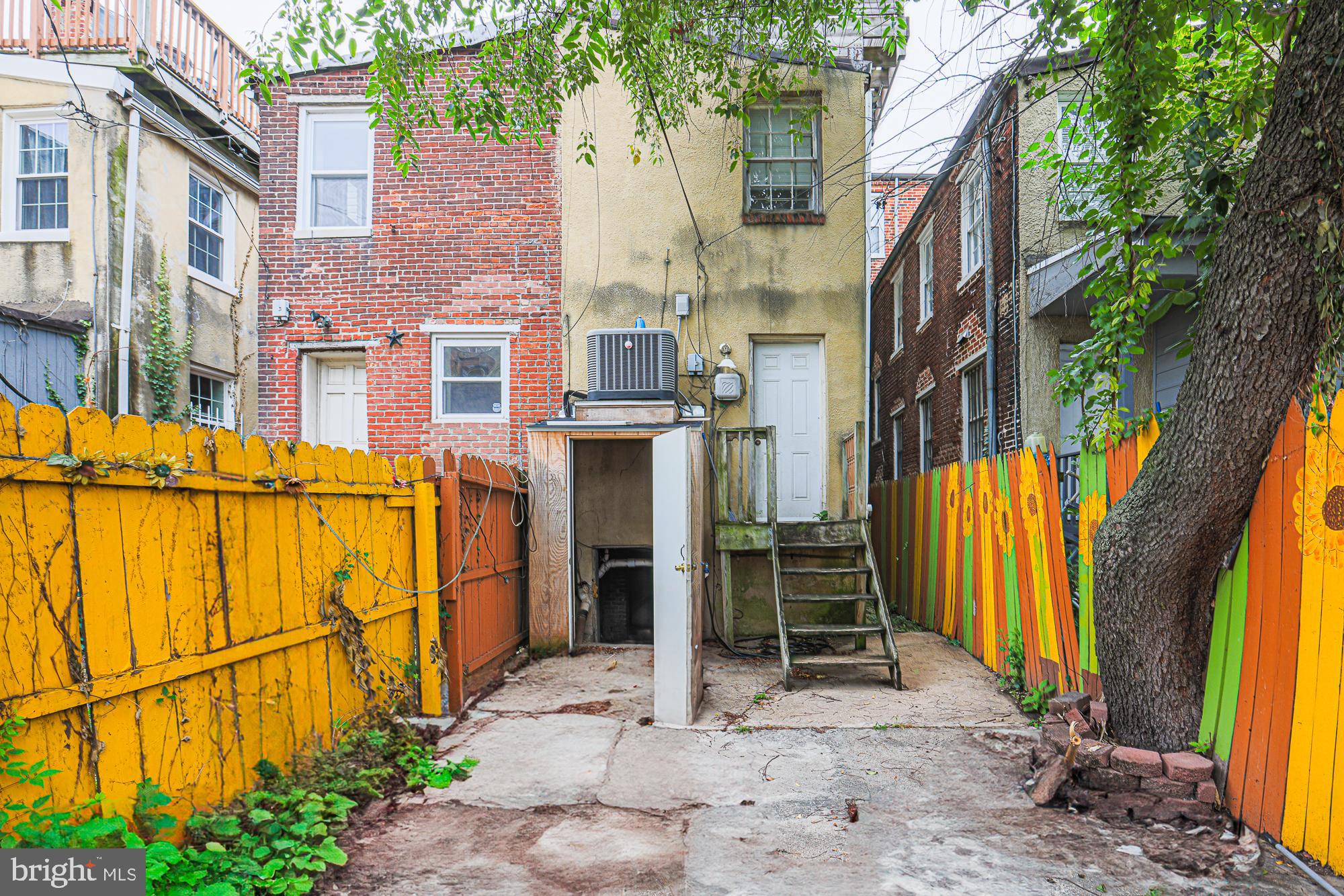 337 Scott Street Baltimore, MD 21230 - Photo 19 of 31 a view of a brick house with many windows and yard