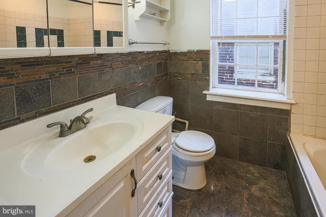 a bathroom with a sink and a toilet