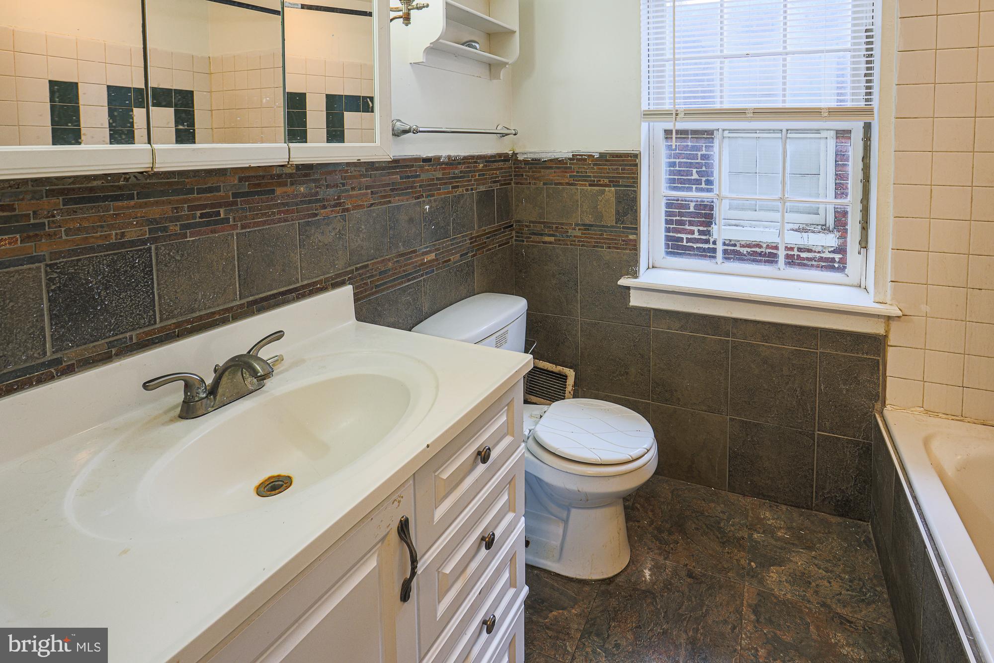 337 Scott Street Baltimore, MD 21230 - Photo 21 of 31 a bathroom with a sink and a toilet