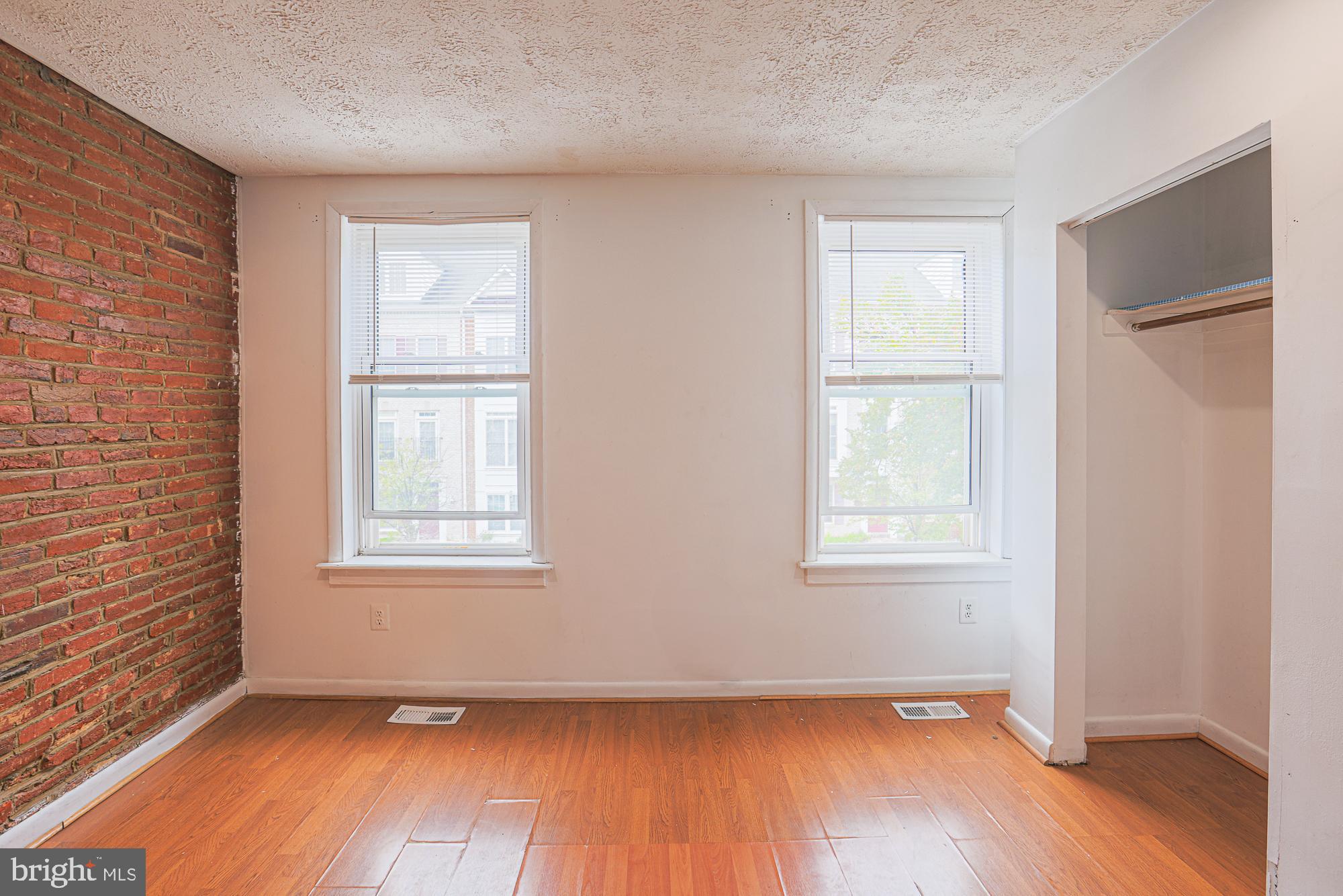 337 Scott Street Baltimore, MD 21230 - Photo 24 of 31 an empty room with wooden floor and windows