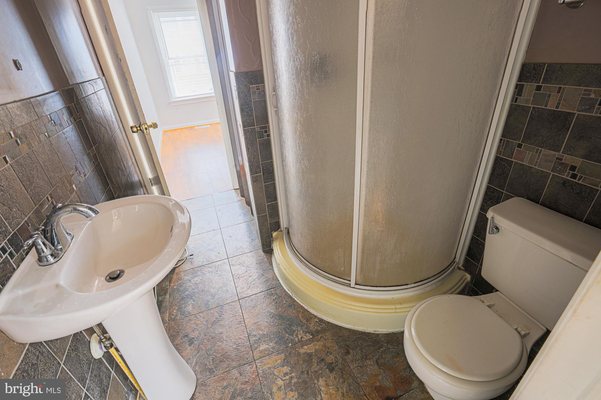 337 Scott Street Baltimore, MD 21230 - Photo 29 of 31 a bathroom with a toilet and a sink