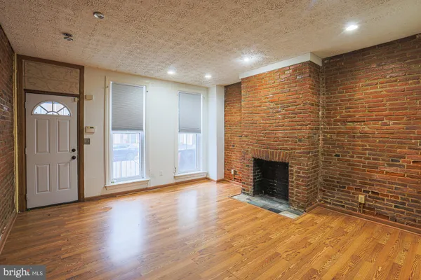 a view of a livingroom with wooden floor